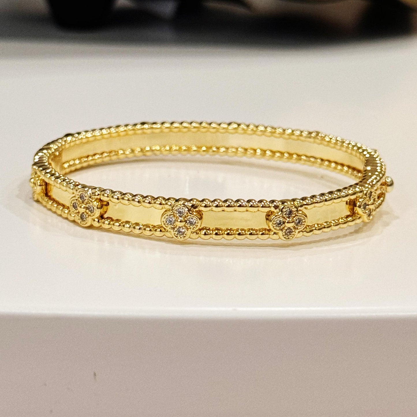 Gold Plated Bangle With Clovers 